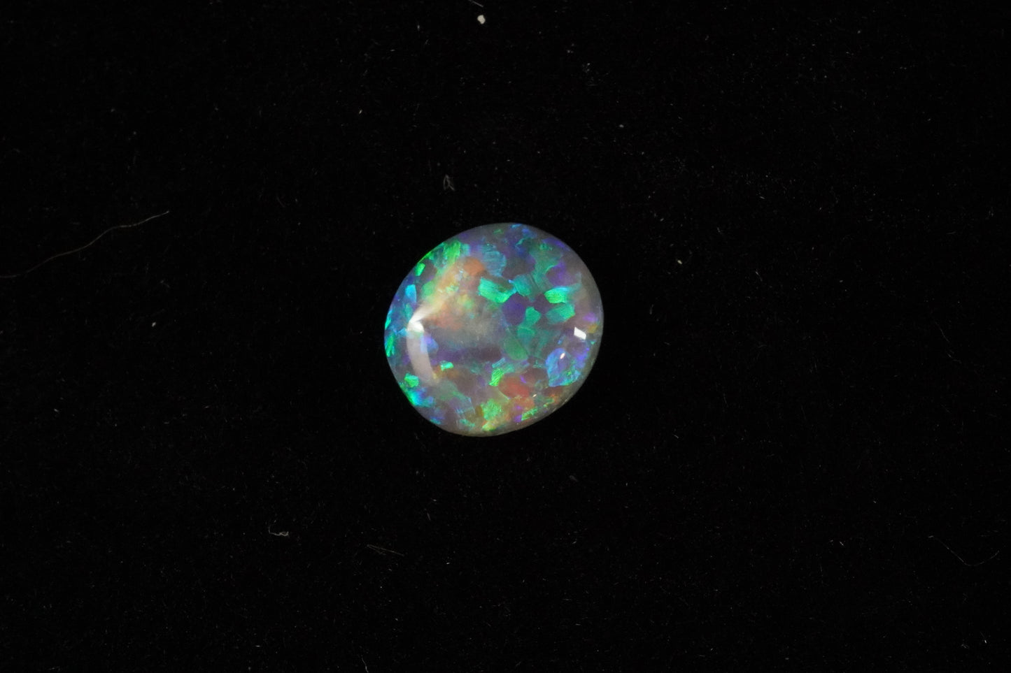0.79 ct Dark Crystal Opal 7.3 x 6.5 x 2.2 mm