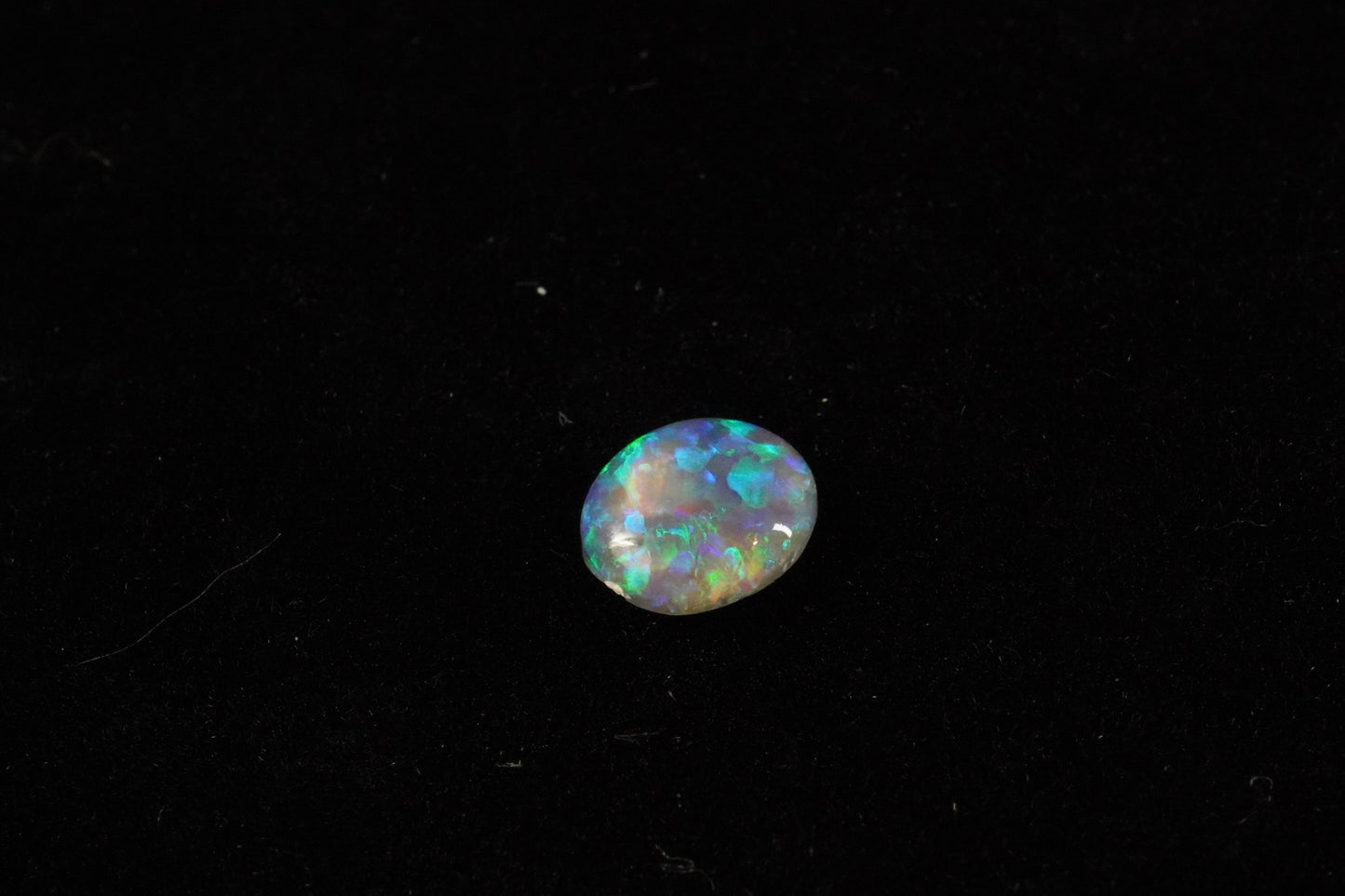 0.79 ct Dark Crystal Opal 7.3 x 6.5 x 2.2 mm